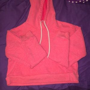 A cropped pink sweater